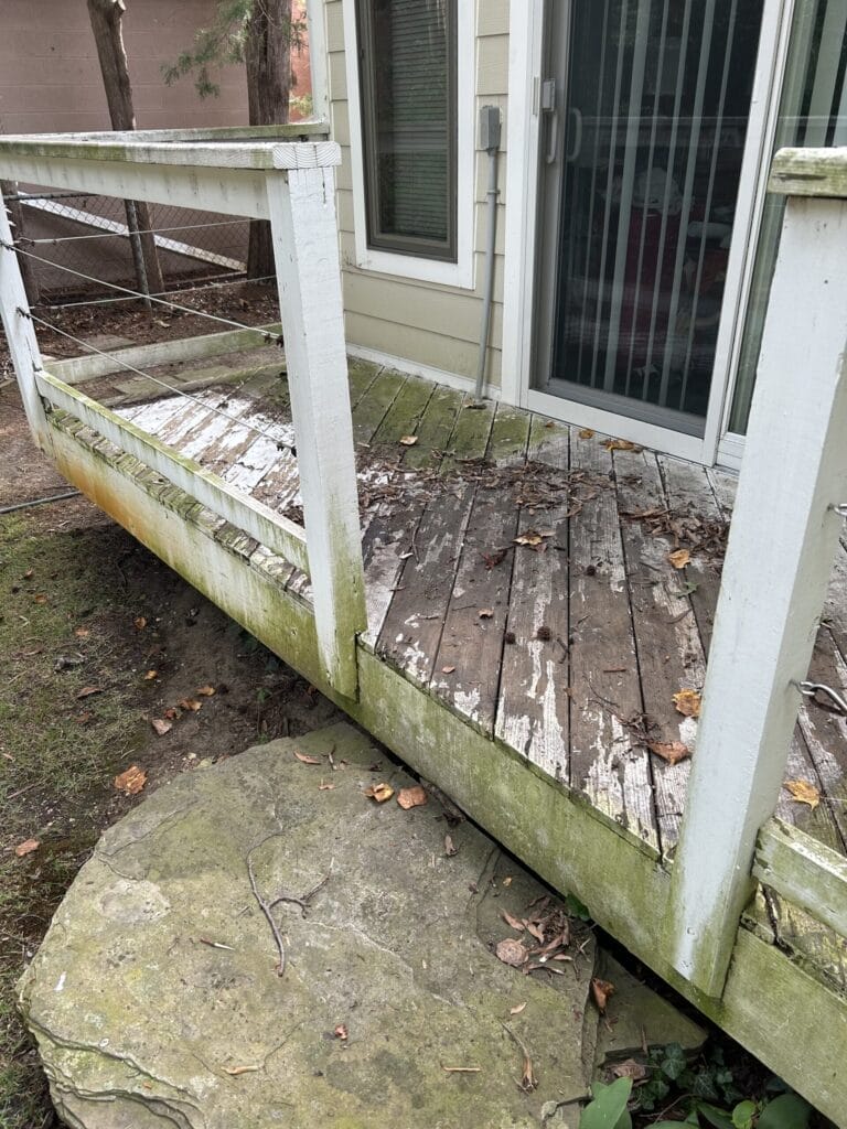 Keenwick team washing residential house exterior