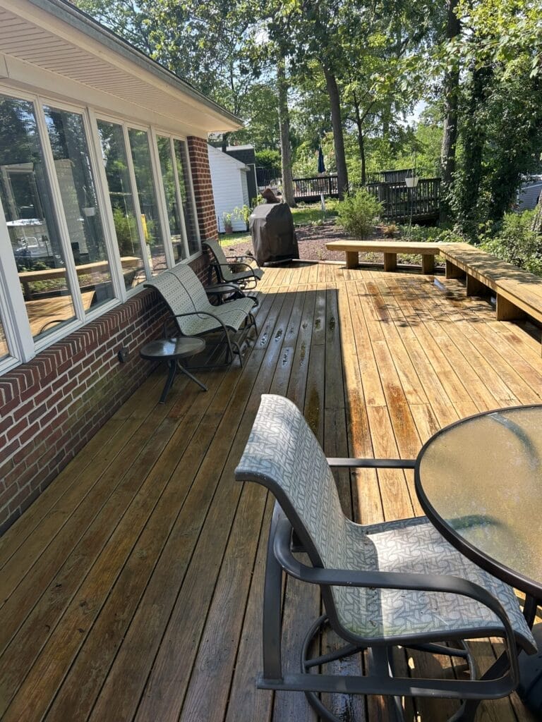 Keenwick team cleaning outdoor patio and garden furniture