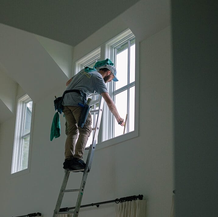 Professional window cleaning service in action